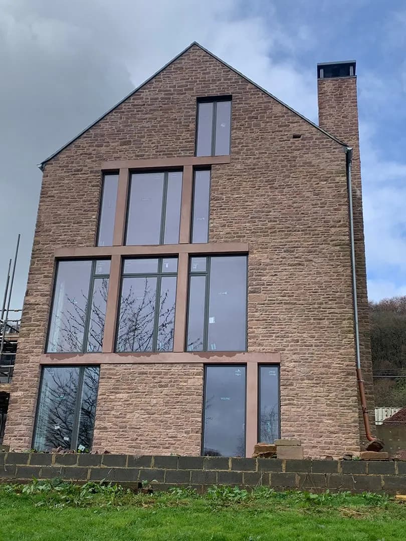 The tall stone gable with full-height windows, Blakeney