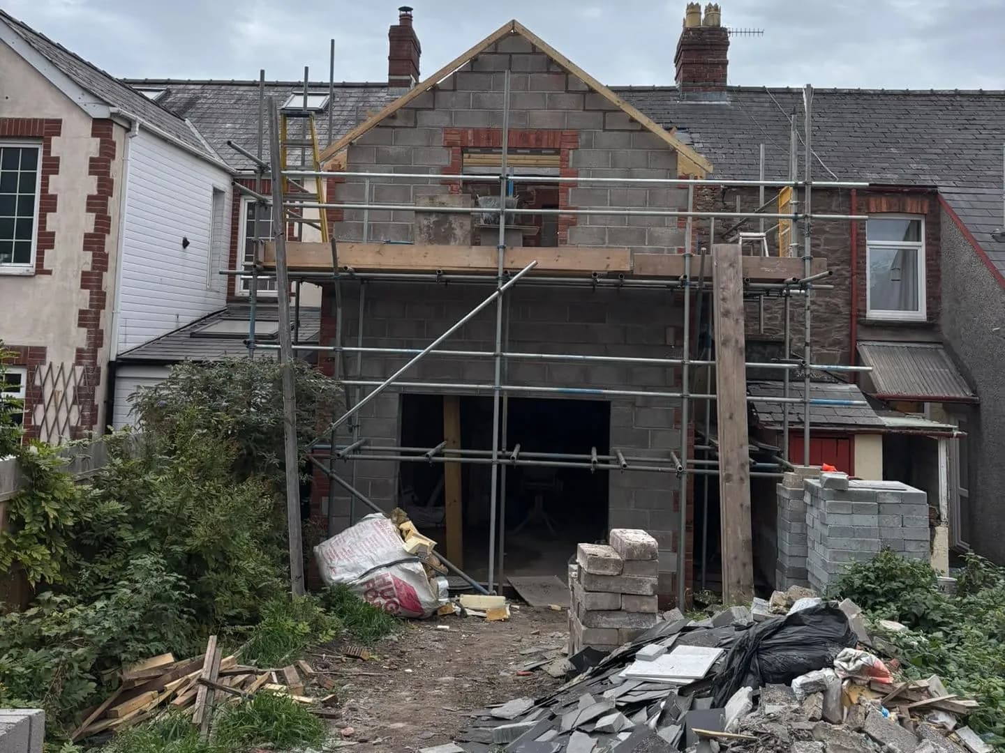 The two storey extension in blockwork with its gable up to the roof, Abergavenny
